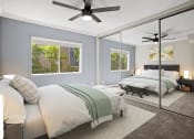 Thumbnail 4 of 15 - Carpeted bedroom with ceiling fan and large mirrored closets.