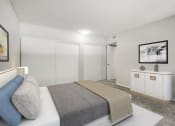 Thumbnail 9 of 28 - Large carpeted private bedroom showing sliding door closets.