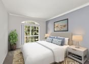 Thumbnail 7 of 20 - Carpeted bedroom featuring beautiful natural lighting and ceiling fan.