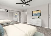Thumbnail 8 of 15 - Carpeted bedroom with large mirrored closet and ceiling fan.