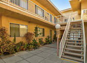 Thumbnail 12 of 18 - Open air courtyard at Woodbridge Park Apartments.