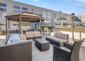 Thumbnail 22 of 29 - Courtyard at Hughes Regency Apartments with gazebo and seating space
