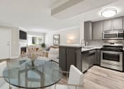 Thumbnail 8 of 15 - Dining room with hardwood floor and view of kitchen and living room.