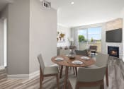 Thumbnail 3 of 27 - Hardwood floored dining room with view of balcony and stone walled fireplace.