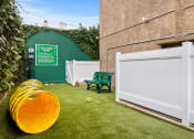 Thumbnail 17 of 25 - Gated on- and off-leash pet park and agility toys.