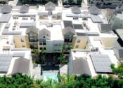 Thumbnail 27 of 27 - Aerial drone image of Palms Court Apartments.