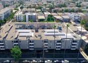 Thumbnail 28 of 29 - Over head drone shot of building with solar panels on roof.