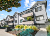 Thumbnail 20 of 23 - Entrance to Woodridge Apartments with drought tolerant landscape.
