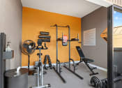 Thumbnail 12 of 20 - On-site fitness center with weight equipment.