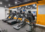 Thumbnail 18 of 29 - On-site fitness center with treadmills and weight machines.