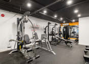 Thumbnail 19 of 29 - On-site fitness center with treadmills and weight machines.