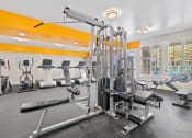 Thumbnail 4 of 27 - Community workout room with bikes, treadmills, and weight equipment