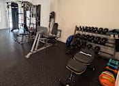 Thumbnail 18 of 24 - Fitness Center with Weight Machines and Free Weights.