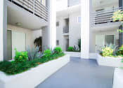 Thumbnail 18 of 22 - Lushly gardened interior courtyard.