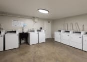 Thumbnail 17 of 24 - Clean, well-maintained community laundry room.
