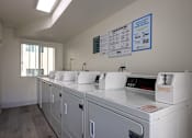 Thumbnail 15 of 19 - Clean and well-maintained laundry room.