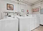 Thumbnail 10 of 15 - On-site laundry room at Vinton Apartments.