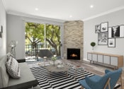 Thumbnail 9 of 27 - Hardwood floored living room with balcony access and stone walled fireplace.