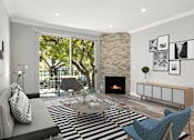 Thumbnail 1 of 24 - Hardwood floored living room with balcony access and stone walled fireplace.