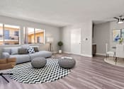 Thumbnail 6 of 22 - Living room with hardwood floor and view of dining area.