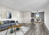Thumbnail 4 of 18 - Spacious hardwood floor living room with view of dining area.