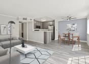 Thumbnail 3 of 15 - Living room with hardwood floor and view of dining room and kitchen area.