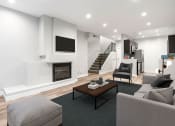 Thumbnail 1 of 22 - Living Room with hardwood floors, fireplace, and access to upper floor.