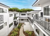 Thumbnail 15 of 24 - Modern styled courtyard with walk up access to apartment homes.