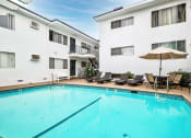 Thumbnail 11 of 24 - Large outdoor pool with lounging space.