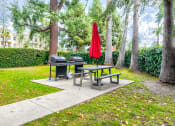 Thumbnail 18 of 21 - Barbecues and seating area adjacent to the private park.