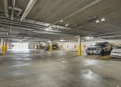 Thumbnail 26 of 29 - Large covered parking lot with assigned parking.