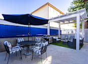Thumbnail 10 of 19 - Additional outdoor seating and grilling area.