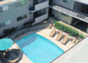 Thumbnail 9 of 14 - Aerial image of gated pool with lounging area.