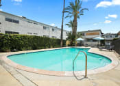 Thumbnail 18 of 28 - One of two large gated pools and lounging area.