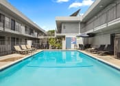 Thumbnail 19 of 28 - One of two large gated pools and lounging area.