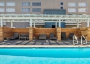 Thumbnail 16 of 29 - Gorgeous pool with divided cabana lounging space