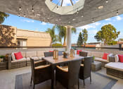 Thumbnail 14 of 20 - Rooftop lounge and dining area.