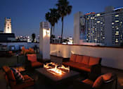 Thumbnail 1 of 23 - Beautiful nighttime view of rooftop patio with gas firepit and view of Franklin below.