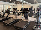 Thumbnail 4 of 24 - Fitness Center With Treadmills, Free Weights, and Bikes.