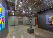 Thumbnail 9 of 35 - Apartment Lobby with modern art sculpture at The Mosaic on Broadway, San Antonio, TX, 78215