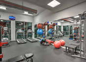 Thumbnail 8 of 35 - Multiple cardiovascular machines in large fitness center at The Mosaic on Broadway, San Antonio, Texas