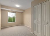 Thumbnail 33 of 50 - A room with a window and a door.