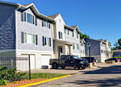 Thumbnail 1 of 6 - a truck parked in front of a row of houses