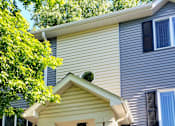 Thumbnail 3 of 6 - the front of a house with stairs and a porch