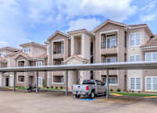 Thumbnail 40 of 41 - A row of houses with a truck parked in front.