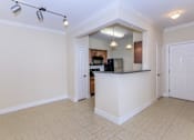 Thumbnail 8 of 41 - A kitchen area with a counter and cabinets.