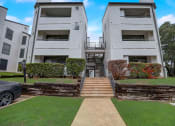 Thumbnail 11 of 11 - an image of an apartment building with stairs in front of it
