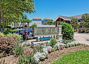 Thumbnail 55 of 55 - A sign that says Flats in front of a building.