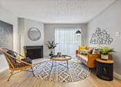 Thumbnail 2 of 18 - a living room with a brown couch and yellow pillows
