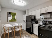 Thumbnail 3 of 42 - a kitchen and dining area in a 555 waverly unit